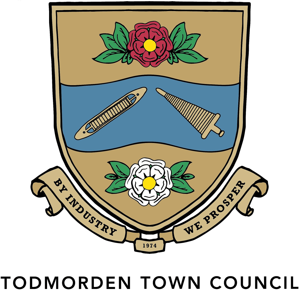 Todmorden Town Council crest showing both red and white roses indicating Todmorden's historic connection with Lancashire even though it is now fully in West Yorkshire - the border between the two counties once passed under the town hall. The crest also includes relics of the town's mill town past (bobbin and shuttle).  There are words on the scroll at the bottom "By Industry We Prosper"