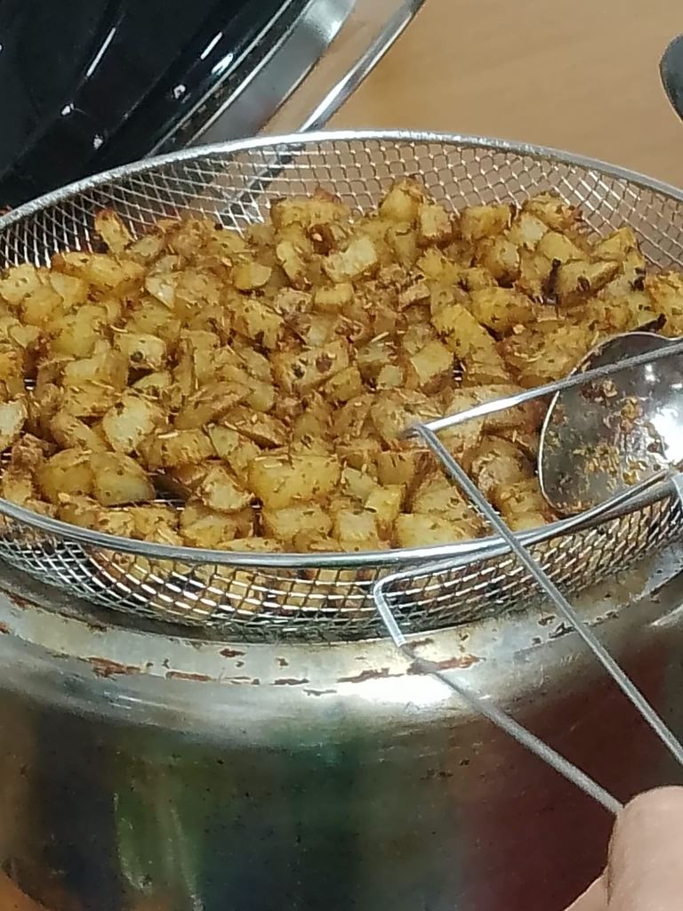 Photo of a grill tray containing air-fried potatoes